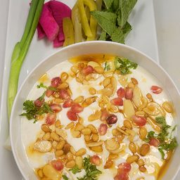 Fatteh yogurt with pomegranate and golden nuts at Cedar North, London Ontario