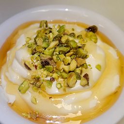 Honey ashta cream with honey and pistachio at Cedar North, London Ontario